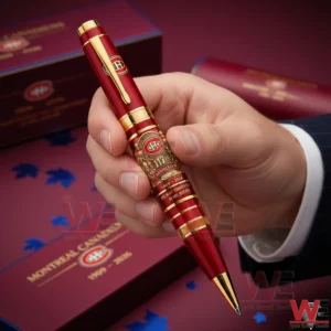 Montreal Canadiens anniversary ballpoint pen held by hand showing red body gold details and intricate club design!
