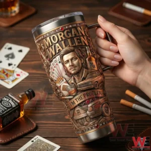 Morgan Wallen I'm The Problem Yeti Tumbler 6 Hand holding a Morgan Wallen themed insulated tumbler over a wooden table!