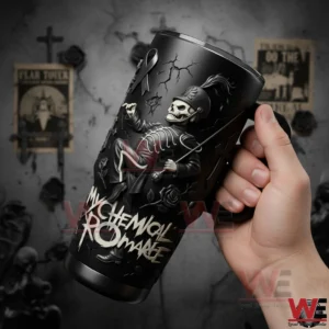Hand holding a My Chemical Romance insulated tumbler with handle marching skeleton artwork cracked textures and bold My Chemical Romance lettering with a blurred gothic themed background!