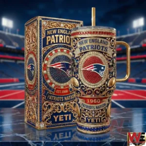 Front view of a red blue and gold insulated tumbler with an ornate New England Patriots design displayed next to a matching decorative box!
