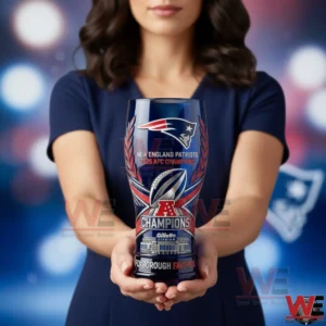 Woman holding a New England Patriots 2025 AFC Champions pint glass with team logo and stadium design against a blurred sports themed background!