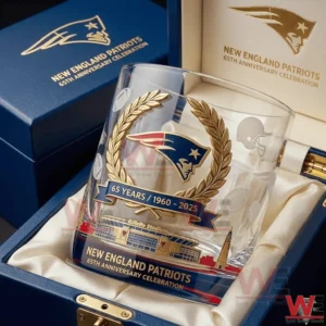 A New England Patriots sixty five year anniversary whiskey glass resting inside a premium box with refined patriotic design elements!