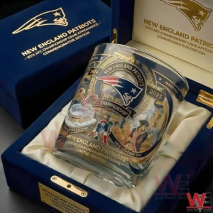 New England Patriots AFC championship whiskey glass resting inside a satin lined gift box with detailed football themed artwork!