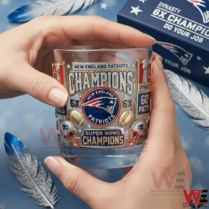 Hands holding a New England Patriots Champions six times Super Bowl clear whiskey glass with detailed team logos and football elements!