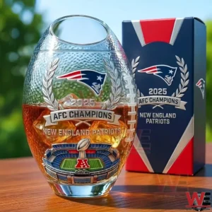Whiskey glass with New England Patriots afc champions design laurel wreath team logo and stadium illustration displayed on a table with a branded box!