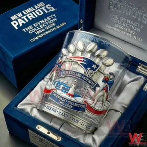 A clear collectible whiskey glass featuring New England Patriots dynasty artwork placed securely inside an elegant presentation case!