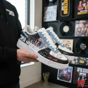Person holding white black and light blue New Kids On The Block sneakers with band photo collage and signature style graphics in a room filled with music records and posters!