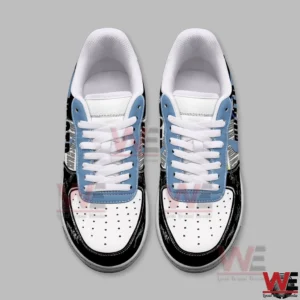Top down view of a pair of white black and light blue low top sneakers with white laces and perforated toe boxes on a plain gray background!