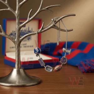 Silver adjustable charm bracelet with New York Giants helmet Giants text stadium football NY logo and trophy charms hanging on a jewelry tree stand with red and blue gift styling.