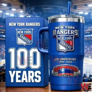 Blue New York Rangers insulated tumbler with commemorative box celebrating one hundred years displayed on a table inside a hockey arena!