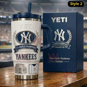 New York Yankees 27x World Champions YETI Collector’s Edition Tumbler Cup 3 White and navy New York Yankees Yeti tumbler with straw and handle showing world champions artwork next to a matching box in a stadium setting.