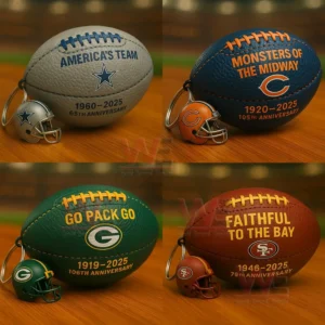 Four football shaped NFL keychains for Cowboys Bears Packers and 49ers with anniversary text and small helmet charms on a wooden table in a stadium background!