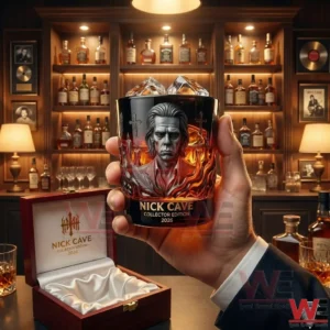 Hand holding a Nick Cave collector whiskey glass with portrait artwork in a luxury whiskey bar setting!