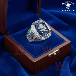 No Shoes Nation Kenny Chesney No Shoes Good Times Community Live in No Shoes Nation Ring 4 Ring placed in an open wooden presentation box with blue velvet lining and a blue gemstone centerpiece.