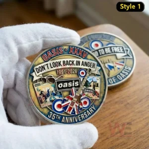 Oasis 1991-2026 35th Anniversary Coin 4 Gloved hand holding an Oasis 35th anniversary commemorative coin featuring Dont Look Back In Anger 1991 2026 artwork with a guitar sunglasses and the Oasis logo!
