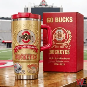 Ohio State Buckeyes one hundred thirty fifth anniversary gold and red handled tumbler with straw next to a red Go Bucks collector edition box on a football field with stadium background!
