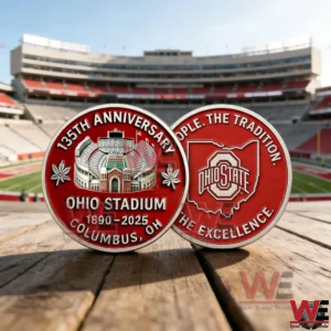 Two red Ohio Stadium anniversary collectible coins on a wooden surface with a football stadium background!
