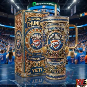 An Oklahoma City Thunder themed insulated tumbler and matching box featuring intricate patterns team logo and Thunder Up slogan displayed on a reflective surface inside a professional basketball stadium!