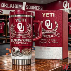 Red Oklahoma Sooners football insulated tumbler with anniversary design and matching fan edition box displayed in a team locker room!