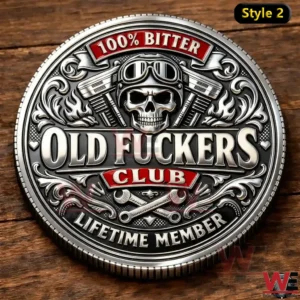 Close up of a silver coin with a goggle skull design and bold text reading One Hundred Percent Bitter Old Fckers Club and Lifetime Member.
