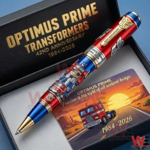 An Optimus Prime Themed Red And Blue Pen Shown In A Gift Box With Transformers Text And A Collectible Card Featuring A Truck Illustration!