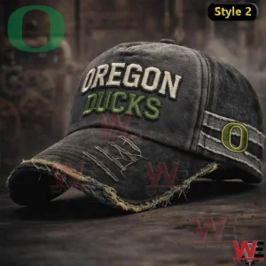 Dark Oregon Ducks cap with distressed brim and stitched team name on wooden surface!