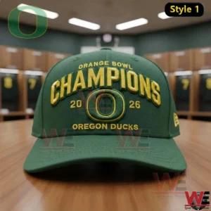 Green Oregon Ducks Orange Bowl Champions 2026 cap with gold embroidered lettering and the O logo displayed on a wooden table in a locker room!