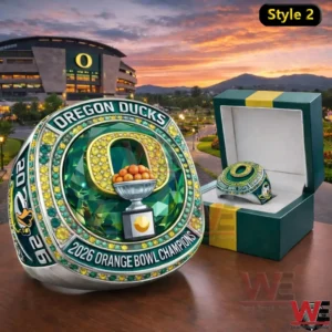 Oregon Ducks 2026 Orange Bowl Champions Custom Ring 4 Silver style Oregon Ducks championship ring with green accents beside an open ring box with a stadium and sunset background!