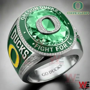 Green Oregon Ducks ring with a large faceted green face and a central letter O bordered by sparkling stones and team lettering around the top.