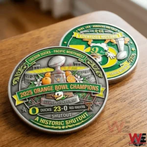 Two Oregon Ducks 2025 Orange Bowl Champions coins on a wooden table with green and yellow enamel design trophy oranges stadium details and historic shutout text!