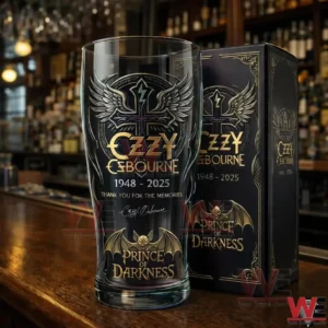 Decorative gothic style glass with winged emblem and gold details displayed on a bar counter with a matching black presentation box!