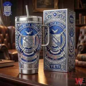 A detailed insulated tumbler and collector box with blue and silver crest design placed on a wooden table with books in the background!