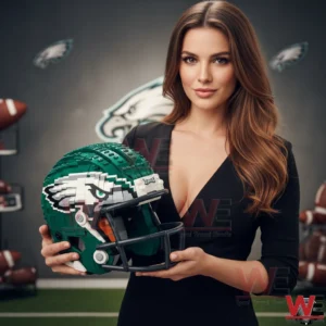 A woman stands indoors holding a green block constructed football helmet with an eagle face design representing a Philadelphia Eagles inspired sports display!