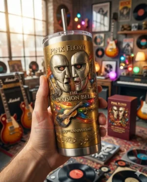 Pink Floyd 50th Anniversary The Division Bell Tumbler 3 Hand holding a Pink Floyd The Division Bell 50th anniversary tumbler with handle and straw in front of a music room background with guitars records and soft colorful lighting!
