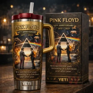 Gold Pink Floyd 50th Anniversary YETI tumbler next to a matching gift box featuring prism rainbow artwork and commemorative years 1975 2025!