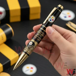 Pittsburgh Steelers anniversary ballpoint pen held by hand showing black body gold trim and team emblem!