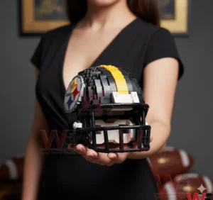 A small block built Pittsburgh Steelers football helmet with black yellow and white colors held in a hand showing fine construction details and team branding!