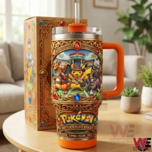 A decorative Pokemon themed insulated tumbler with a handle and straw standing on a table next to its illustrated collector box in a cozy living room setting.