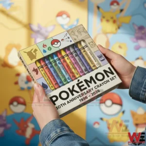 Pokemon 30TH ANNIVERSARY CRAYON SET 3 Hands holding a Pokemon thirtieth anniversary crayon set with colorful crayons and themed packaging in a bright playful setting!