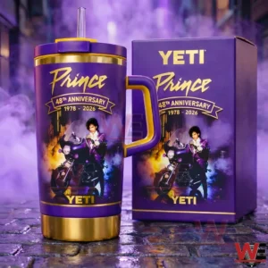 Purple and gold Prince 48th anniversary handled tumbler with straw beside a matching purple gift box in a dramatic purple background!