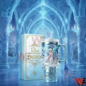 Frozen anniversary insulated tumbler displayed with a matching gift box in an icy palace setting with winter themed background!