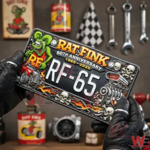 Rat Fink 60th Anniversary Motorcycle License Plate Frame 3 Gloved hands holding a Rat Fink sixty anniversary license plate with hot rod graphics flames skulls and engine art in a garage workshop background!