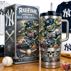 Stainless travel tumbler with metal handle black lid and straw next to a matching Rat Fink Hot Rod New York Yankees Limited Edition collector box with Yankees apparel and a baseball in the background.