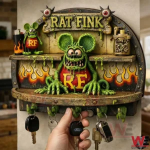 Rat Fink wall key holder with a green monster figure flames and hand shaped hooks holding multiple sets of keys with a hand reaching for one.