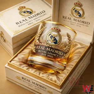 A Real Madrid royal legacy whiskey glass displayed inside a luxurious cream and gold presentation box!