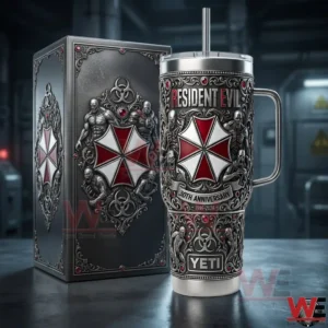 A Resident Evil themed stainless steel tumbler with handle and straw placed beside an ornate display box featuring detailed gothic designs and the umbrella emblem!