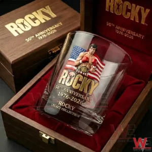 Clear commemorative glass inside a wooden box with red velvet interior featuring a boxer illustration with gloves an American flag background and gold anniversary themed text!