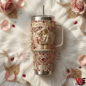 Romantic themed insulated tumbler with Romeo and Juliet artwork roses gemstone details and ornate gold styling displayed on a soft decorative background!