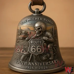 A Route 66 anniversary bell shown in close detail with metal artwork of a biker road signs desert scenery and historic travel symbolism!