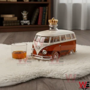A classic Volkswagen van shaped whiskey bottle with amber liquid sitting on a soft rug next to a small glass in a stylish indoor setting!